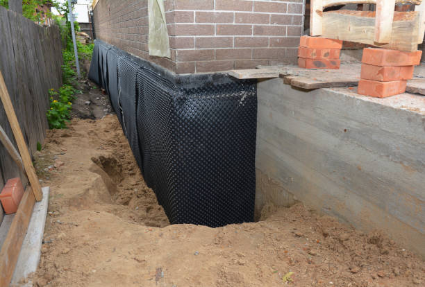 SJ Waterproofing Pros technician performing targeted Basement Waterproofing assessment in Fairview, OR